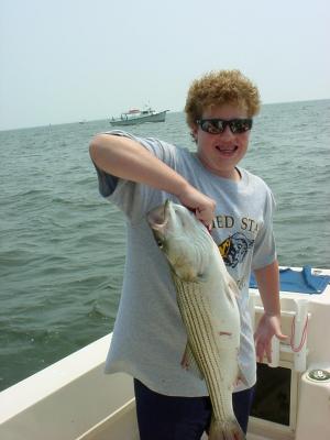 7/25/2005 Hank Cassidy Family Charter - Shows off nice 30 Striper