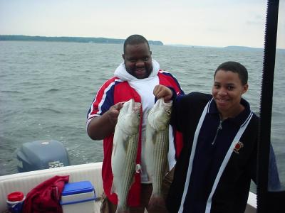 7/29/05 - Tim shows off with nice Striper