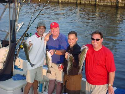 9/1/2005 Rich Becker afternoon charter shows off some of the limit fo Stripers caught off the Magothy onboard the Down Time