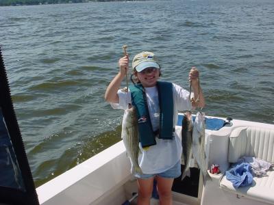 9/4/2005 - Swalm Family Charter - Nickie shows off some nice Stripers show caught