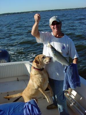 9/28/05 - Dr Ray shows off nice Rock with Jessie taking a good lick! Its a keeper!