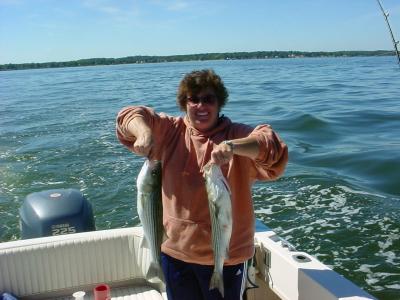 9/30/2005 - Pam B. Charter - Shows off a some of limit of Stripers to 24