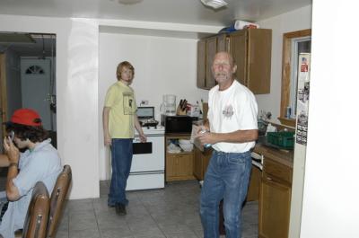 Justin, Christopher and Bob in slanting kitchen