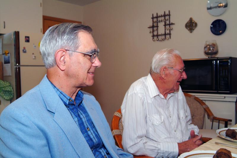 Rev. Meinerts & Henry at table