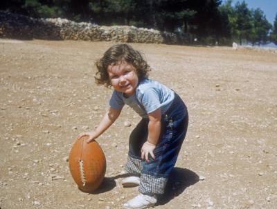 Elizabeth with Football in the Boys' Home Playing Field