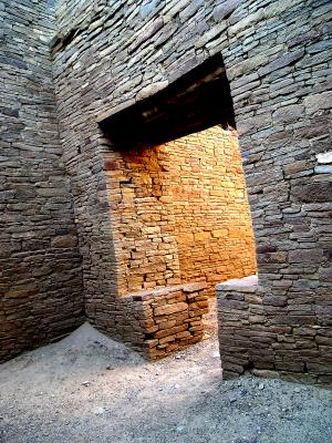 A uniquely Chacoan doorway...a doorway deep inside Pueblo Bonito with the late day sun bouncing off the wall that is out of sight in the next room. It almost seems as though there might be Chacoans in the next room warming themselves by a fire.