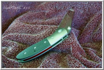 HP LCCDA Abalone studs, CF Scales, Satin Ti bolsters, Red Back Spacer