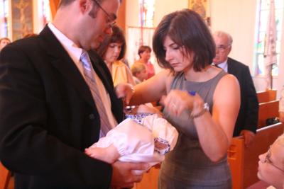 godmother undresses the baby