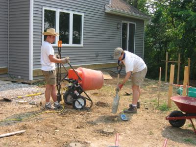Filling each 8 dia. Quik-tube with concrete