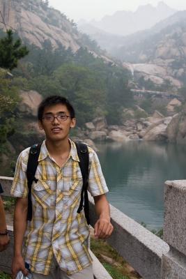 Zheng Long in front of the lake.