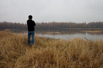 Masa standing in front of the lake.