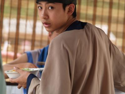 A boy serving the food