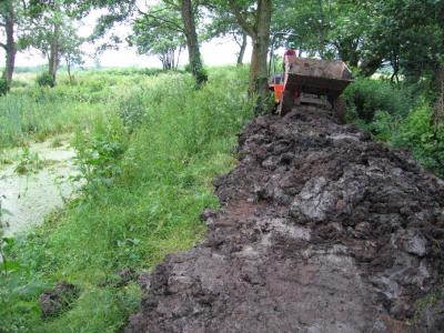 and was also used to raise the banks of the second side pond