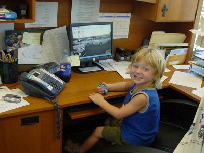 Riley at daddy's desk