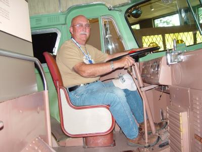 HERE I AM WELCOMING YOU ABOARD THE 1951 FLIXABLE ATHLETIC AND PASS BUS
