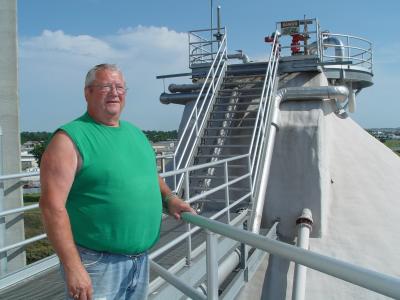 MEL LOOKS OUT OVER HIS DOMAIN NEAR THE TOP OF ONE OF THE EGGS (DIGESTERS)  80 FEET IN THE AIR