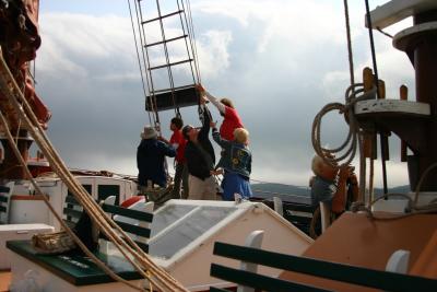 hoisting sail on the schooner Margaret Todd