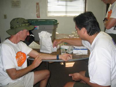 At the Furnace Creek Medical HQ, we teach Kent to work the iSTAT machine, and we practice on each other.