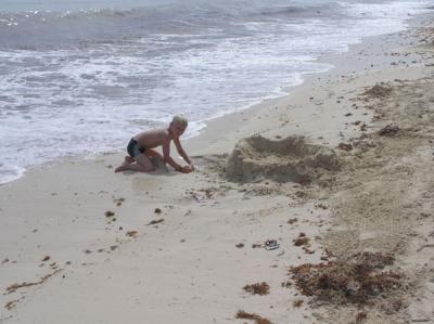Kid making a sand castle