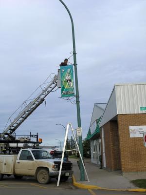Mayor hanging the banner's