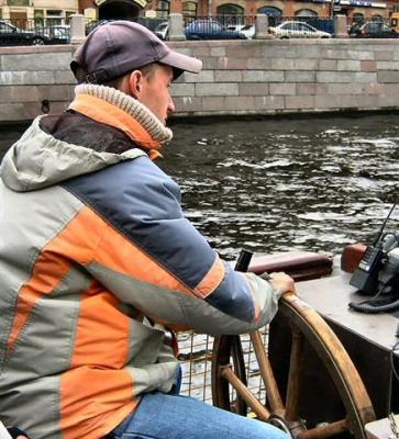 Our boat skipper through the canals.JPG