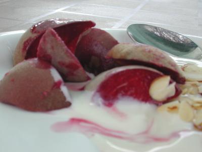 blood peaches in fresh yogurt with almond slivers