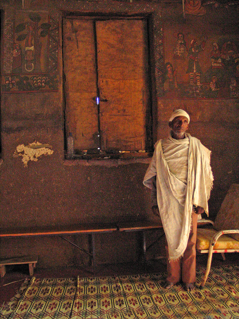 Priest in his church