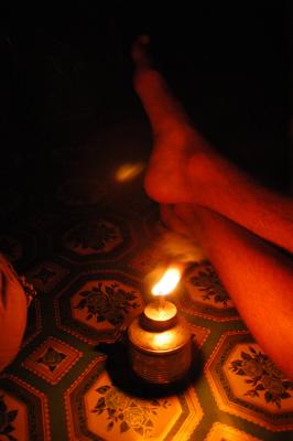 feet by oil lamp