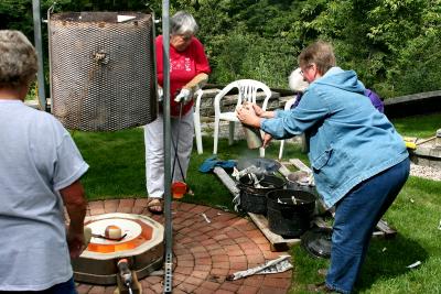 Removal of last piece into black pot.