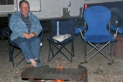 Mom and Dusty sitting by the campfire
