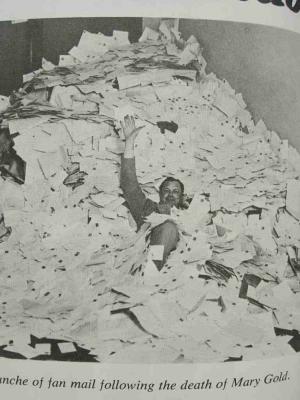 A photo of Smith buried under a veritable avalanche of fan mail following the death of his character Mary Gold