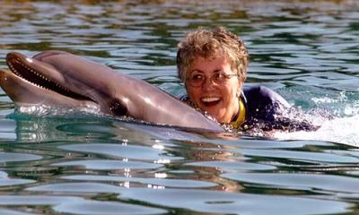 Elizabeth Liz Jones Kettleman swimming with a dolphin