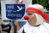 War is not the answer held by sad-faced clown