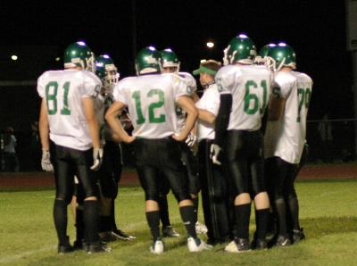 Coach McManus and the offense during a timeout