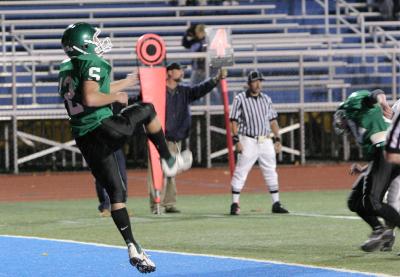 Luke Daly punting from the end zone