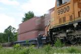 Q649's conductor watches NB intermodal Q124 fly by at south Decker.