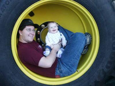 Bill  & Lilli in tractor wheel 1.jpg