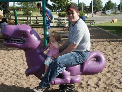 Riding the purple dinosour with daddy.jpg