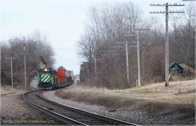 BN Engine 7021 leading stack train thru old IC overpass near Polo Illinois.jpg