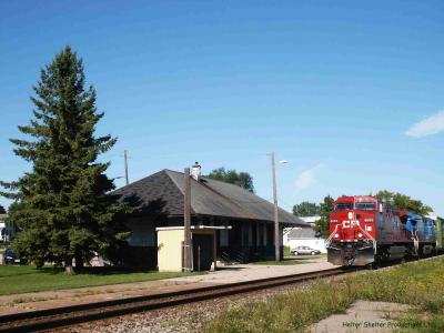 CP Engine 8650 leads mixed freight train passed Tomah Wisconsin depot.jpg