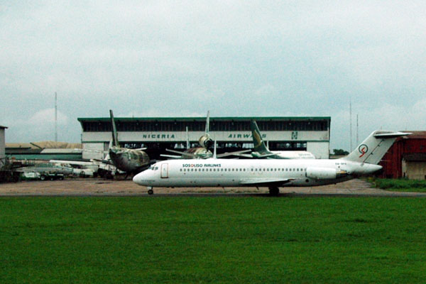 Sosouso Airlines DC9 taxiing past the derelict Nigeria Airways hangar at Lagos