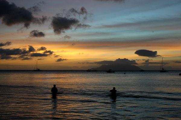 Local men fishing at sunset, Beau Vallon