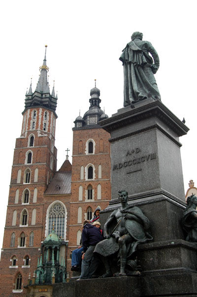 The Adam Mickiewicz statue is surrounded by 4 allegorical figures
