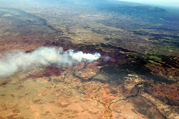 Forest fire along the rim of the Great Rift Valley just south of Lake Naivasha, Kenya