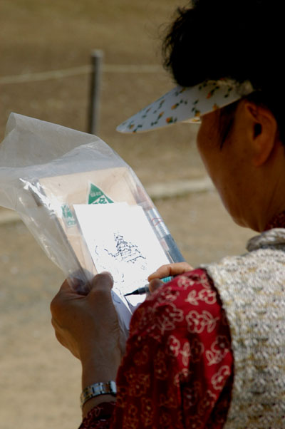 Woman sketching Himeji Castle
