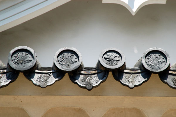Decorative roof tiles bearing the crest of the castle's lord