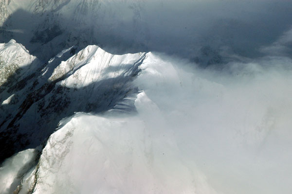 Strong winds blowing snow across the ridge of the Passu Massif, Pakistan