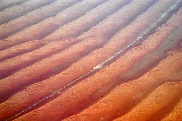 A rare road running between the parallel dunes in the Empty Quarter, Saudi Arabia