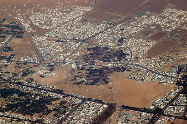 Buraimi, Oman is almost completely surrounded by Al Ain