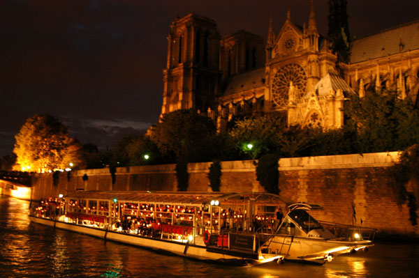 The second of about ten boats in the flotilla passing Notre Dame